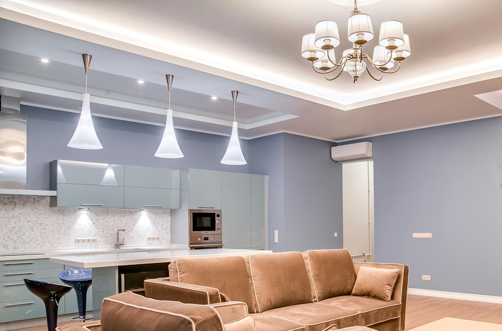 Stylish minimalist living room and kitchen with modern furniture and elegant design.